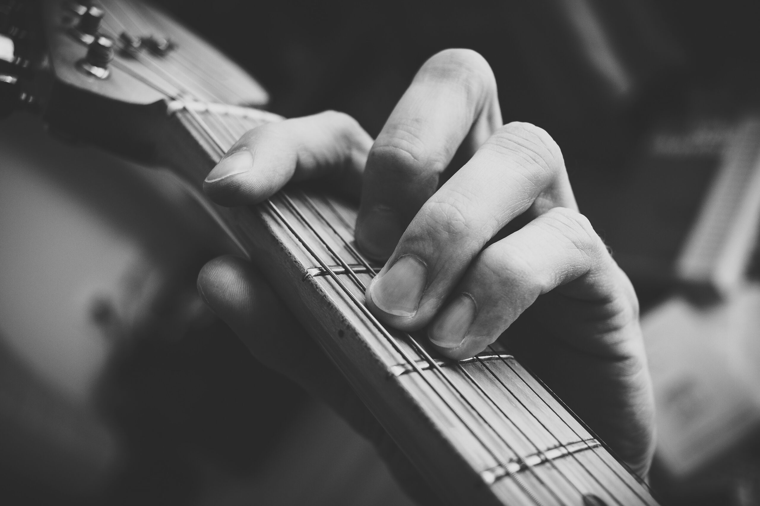 Guitarist playing an F barre chord